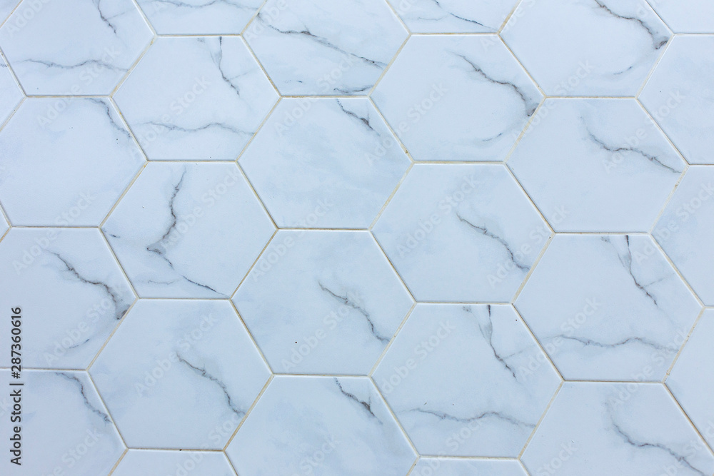 White hexagon marble tile wall for texture background . White hexagon marble tile wall for texture background .