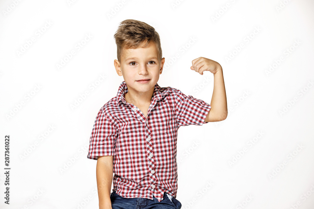 handsome boy shows his strength on white background handsome boy shows his strength on white background