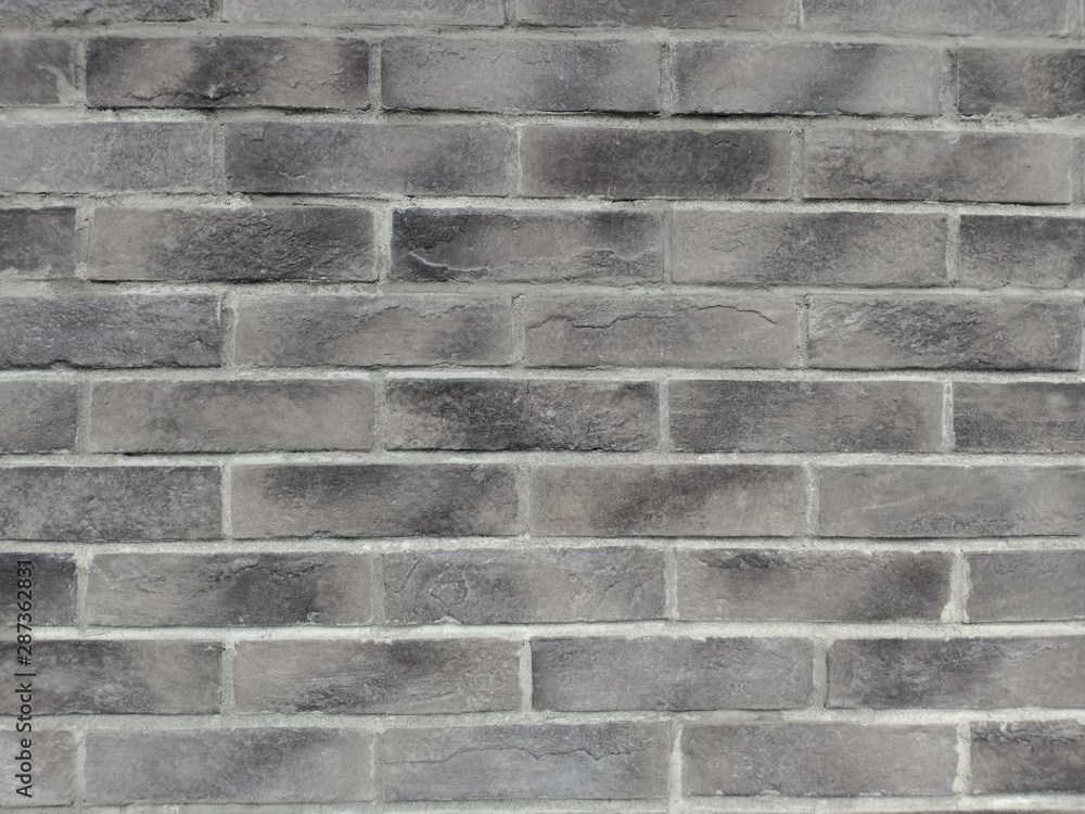 Gray brick wall. Construction material texture. Gray brick wall. Construction material texture.