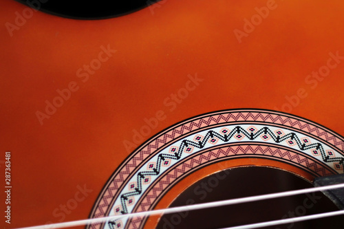 Color detail of an nice classical guitar. © DALU11