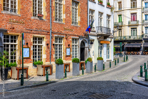 Photography Old street with tables of brasserie in center of Brussels, Belgium