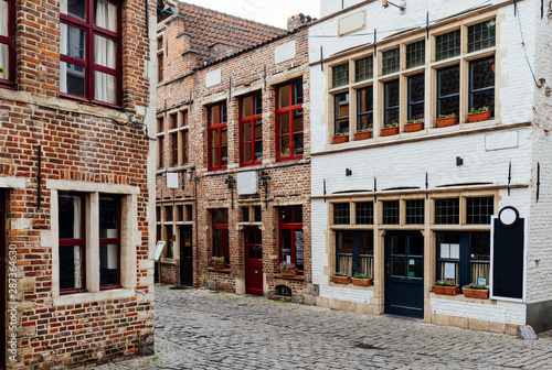 Old narrow street in Ghent (Gent), Belgium. Architecture and landmark of Ghent. Cozy cityscape of Ghent.