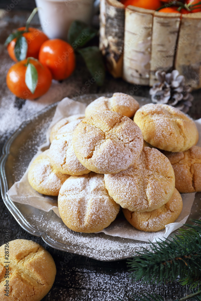 Winter baking. Homemade tangerine cookies, powdered sugar dressing