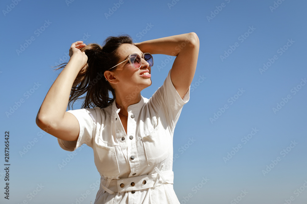 beautiful woman with wavy dark hair walks around the city beautiful woman with wavy dark hair walks around the city