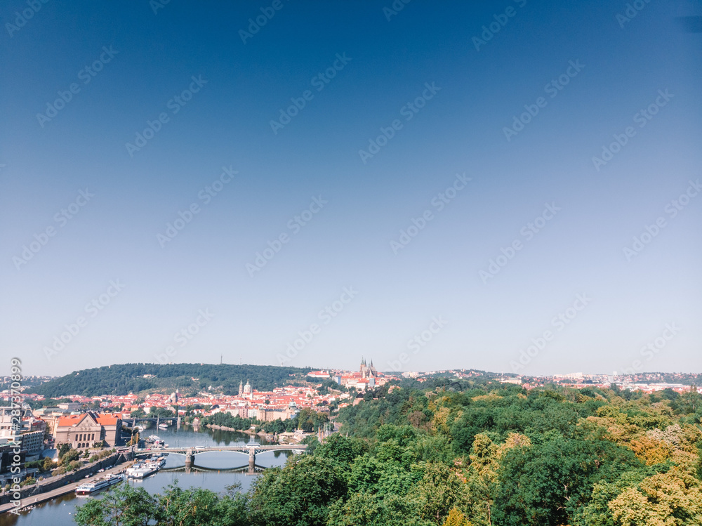 Scenic summer sunrise aerial view of the Old Town pier architecture and Charles Bridge over Vltava river in Prague, Czech Republic, travel tour to Europe concept design. copy space