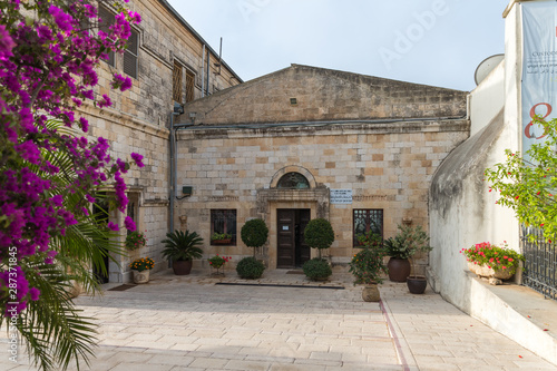 Fototapeta Naklejka Na Ścianę i Meble -  The building for the pilgrims to stay on the territory of the catholic Christian Transfiguration Church located on Mount Tavor near Nazareth in Israel