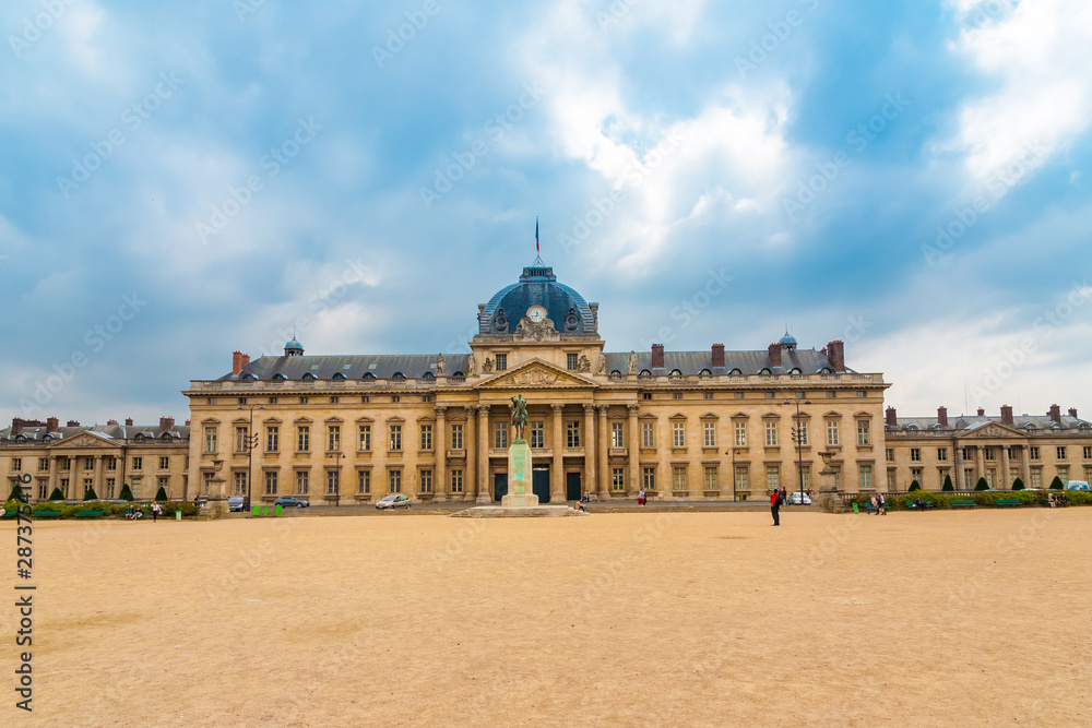 Great panoramic view of the École Militaire (military school) in Paris at the opposite end of the Champ-de-Mars park on a cloudy day. Today it houses a training school for French army officers. 
