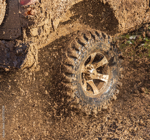SUV wheel stalled in mud and water © schankz