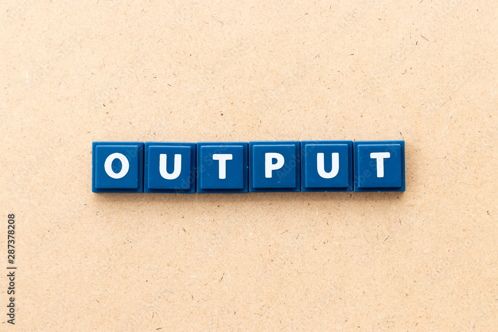 Tile letter in word output on wood background
