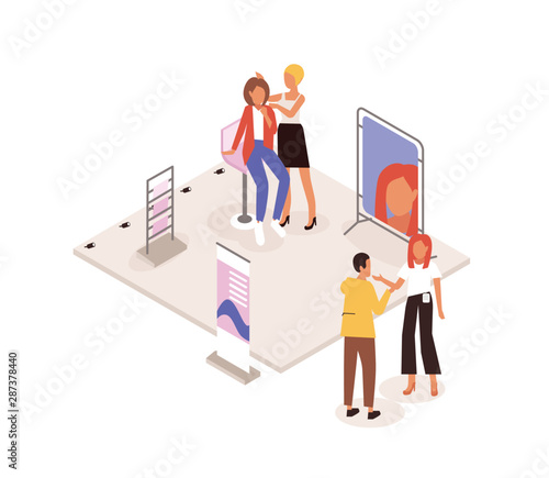 Makeup artist and woman at commercial promotional stand of cosmetics product