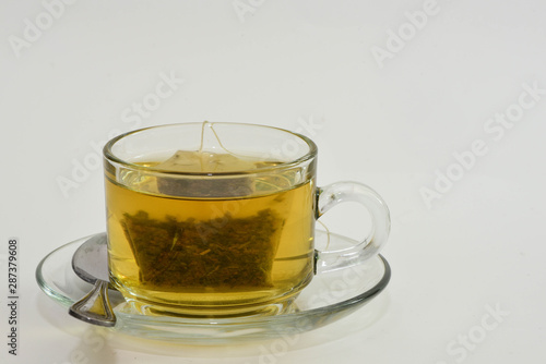 Tea and Green Tea bag in glass cup is ready to drink
