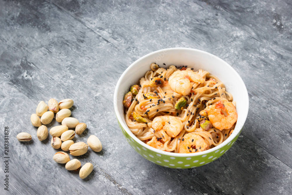 Fototapeta premium Shrimps with soba noodles and shrimps - asian food creative concept.