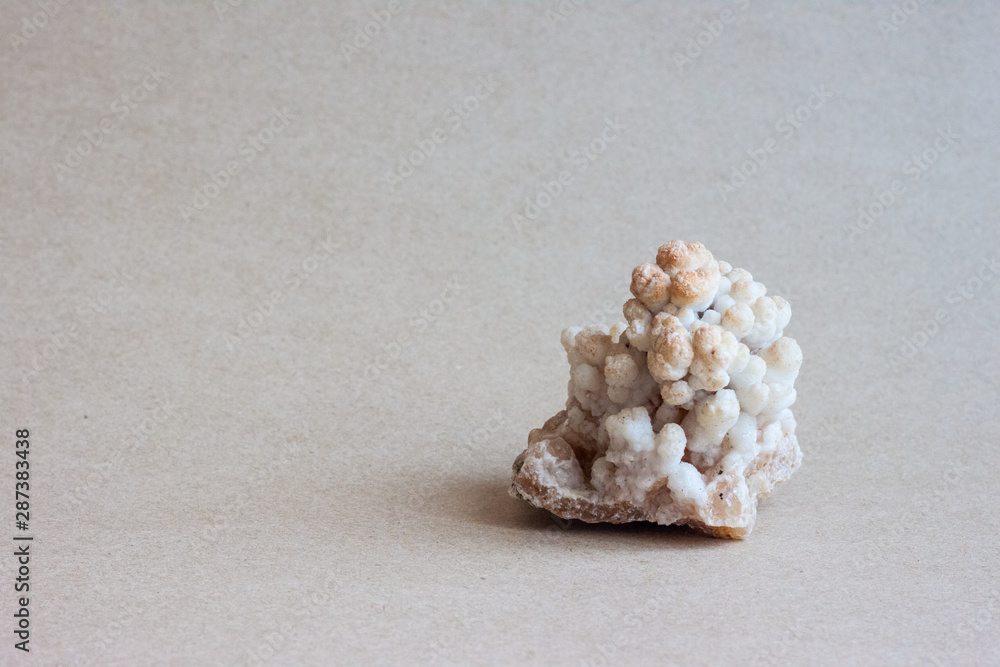 Small white marble cubes on brown paper. Small white marble cubes on brown paper.