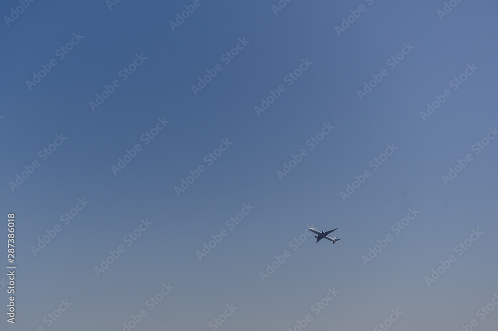 plane on the blue sky