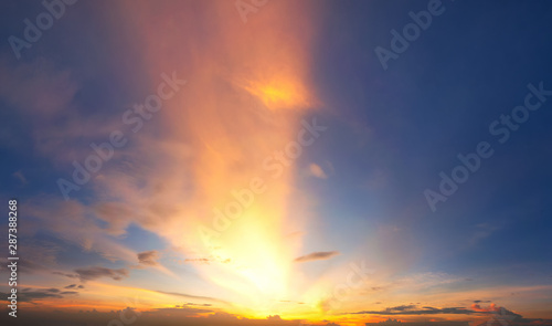 Dramadic Sunset Sky blue and orange light of the sun through the clouds in the sky © Sky Stock