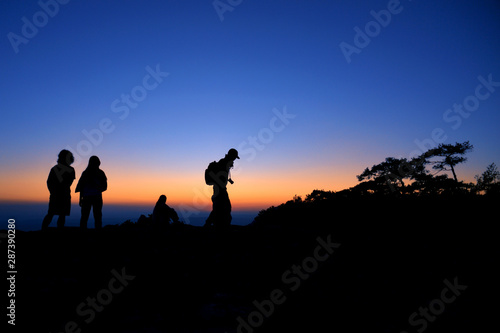 The silhouette of tourist in the mountains