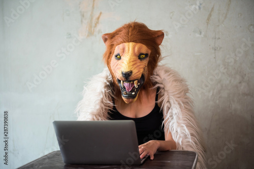 Foto Illegal business over internet by lion mask girl