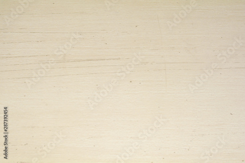 Scratched cream wood surface background. Wood grain pattern texture background in light cream beige color tone.