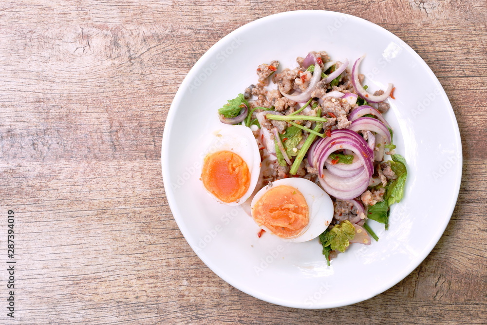 boiled egg half cutting topping sour and spicy minced pork salad on plate boiled egg half cutting topping sour and spicy minced pork salad on plate
