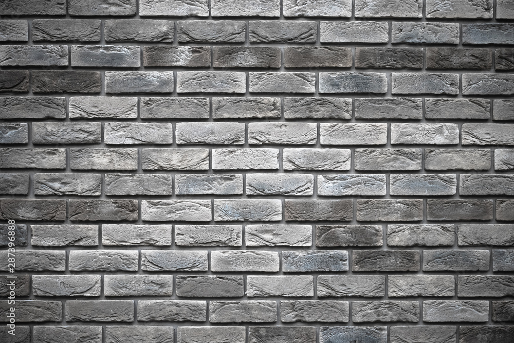 Gray brick wall. Old dirty cement wall texture. Abstract pattern. Dark vintage brickwork. Concrete stone grunge background.