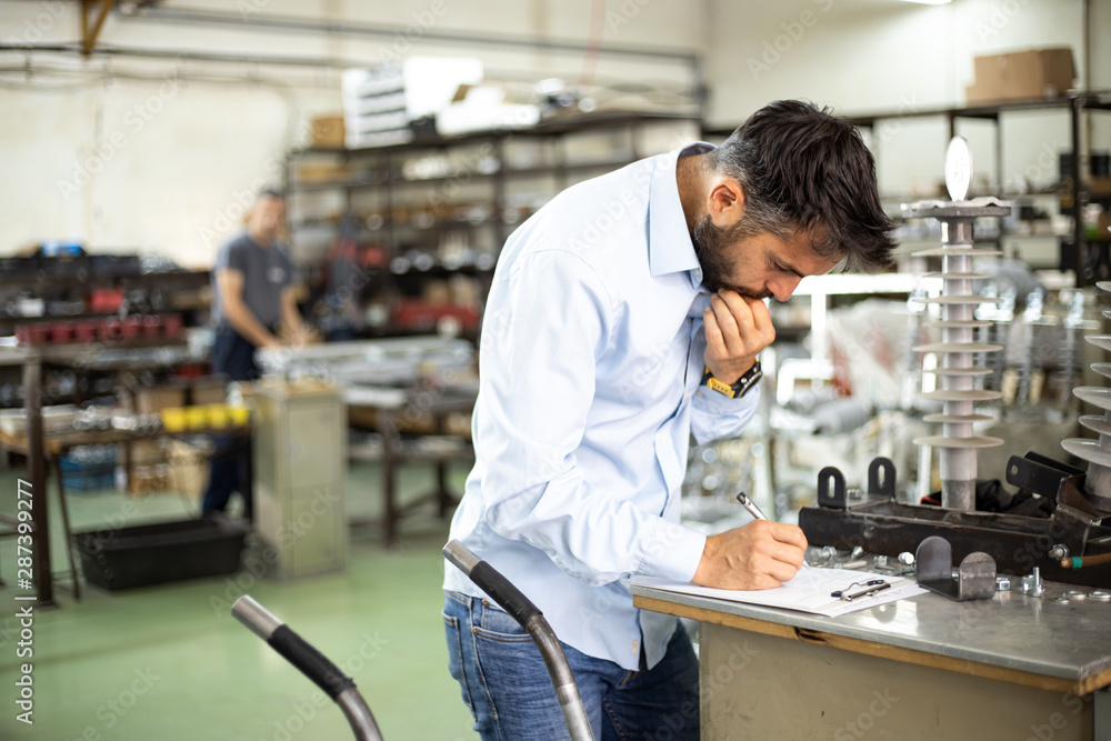 The engineer oversees the process of working in an electrical workshop,stock photo The engineer oversees the process of working in an electrical workshop,stock photo