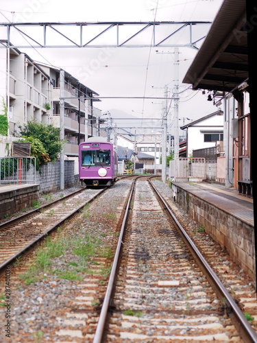 Local tram train leaving the station in Arashiyama, Kyoto, Japan.