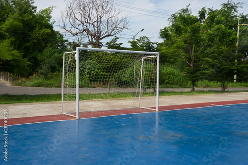 Futsal goal on blue field,soccer concept. © peerayot