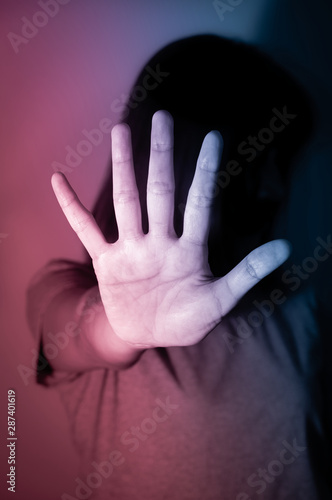 Woman make stop sign with hand.