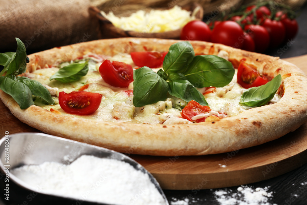 vegetarian italian Pizza with tomatoes, mozzarella cheese and basil. Delicious italian pizza vegetarian italian Pizza with tomatoes, mozzarella cheese and basil. Delicious italian pizza