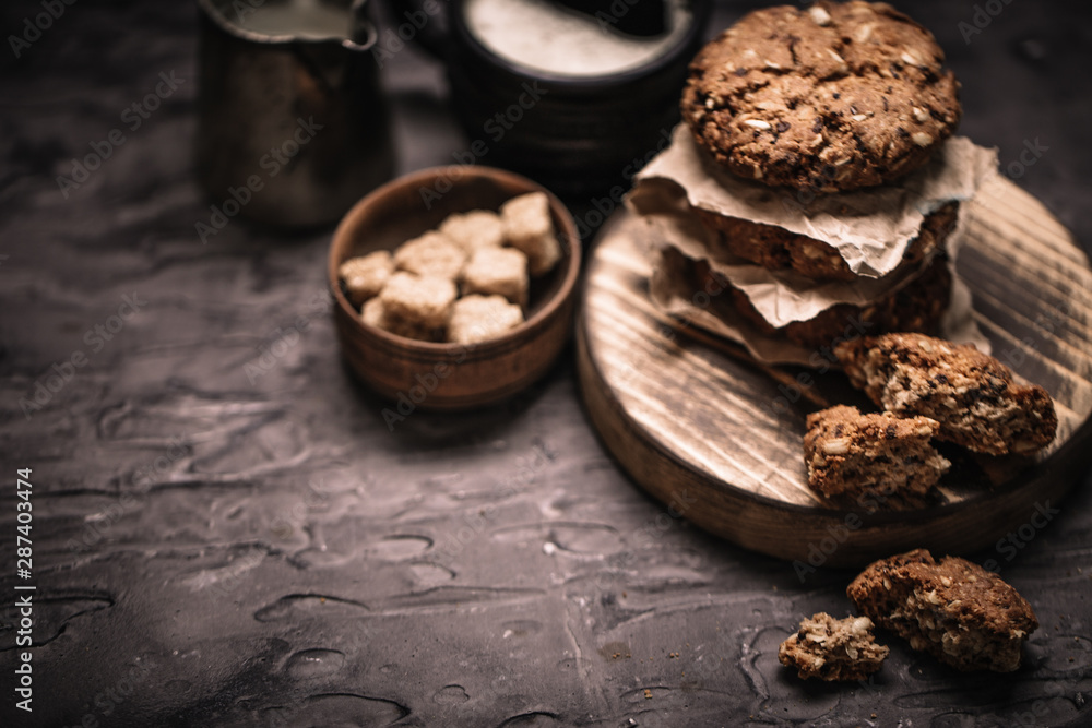 Sweet cookies with on dark textured background.