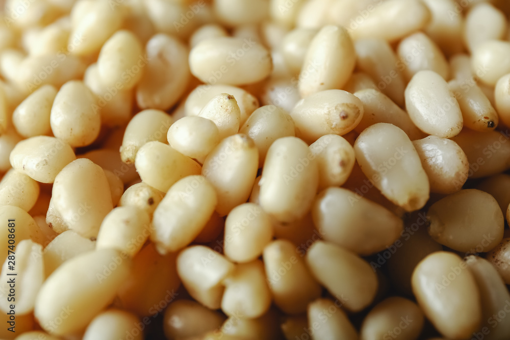 Background texture of shelled pine nuts. Cedar. Background texture of shelled pine nuts. Cedar.