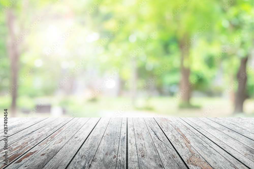 Empty wooden table with party in garden background blurred. Empty wooden table with party in garden background blurred.
