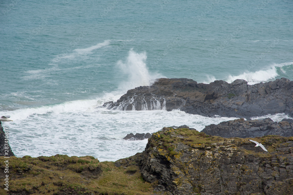 The view of sea, cliffs and waves from the coastal path in north Cornwall near to Padstow