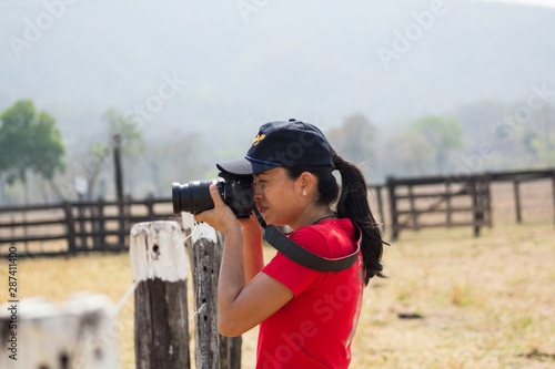 young woman with a camera