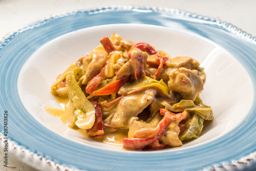 Butter Chicken Curry with Cream and Vegetables in Plate Ready to Serve Butter Chicken Curry with Cream and Vegetables in Plate Ready to Serve