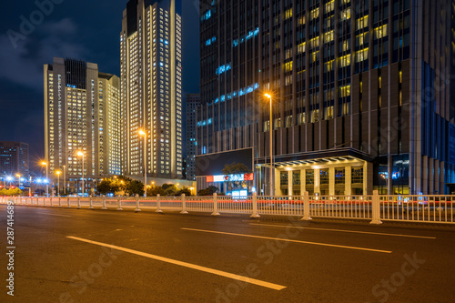 Office buildings and highways at night in the financial center, qingdao, China