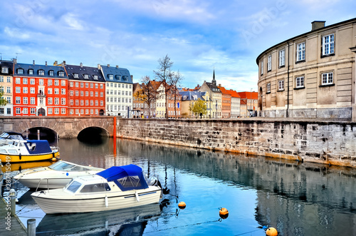 Copenhagen, Denmark, canal scene with boats and picturesque traditional buildings photo