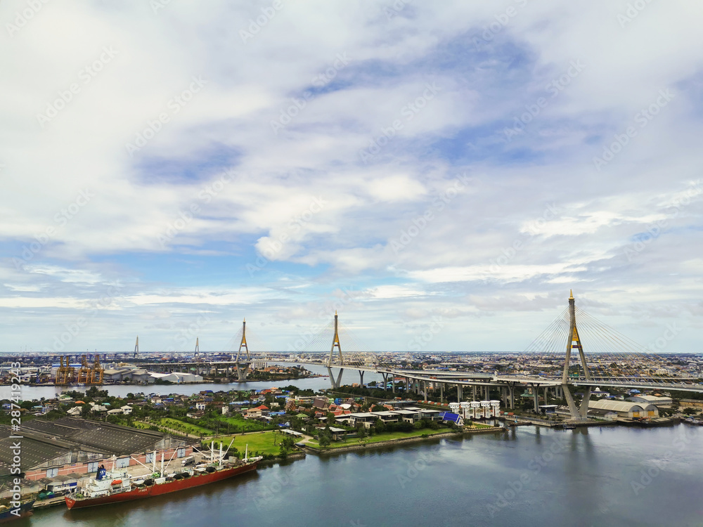 Bhumibol Bridge with river, cityscape view and cloudy blue sky in the morning.