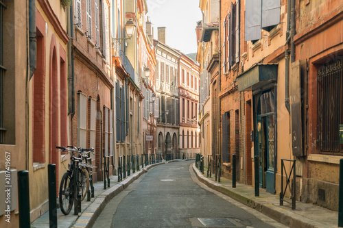 An alley in the heart of the old city of Toulouse, Haute-Garonne, France photo