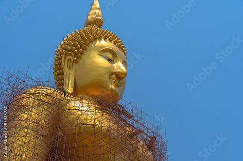 The new golden coloring work of Big Buddha in Ang Thong province The largest Buddha statue in Thailand And the largest in the world. photo