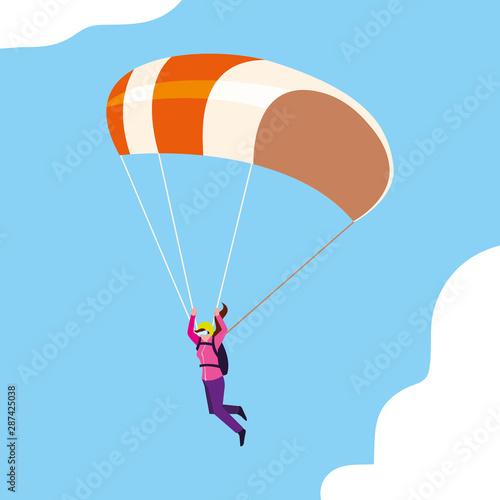 woman skydiver in air with parachute open