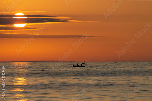 Sunrise at Lake Michigan Fishing boats sailing on Lake Michigan   beginning the salmon fishing 