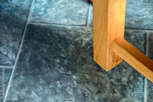 A chair leg and kitchen floor