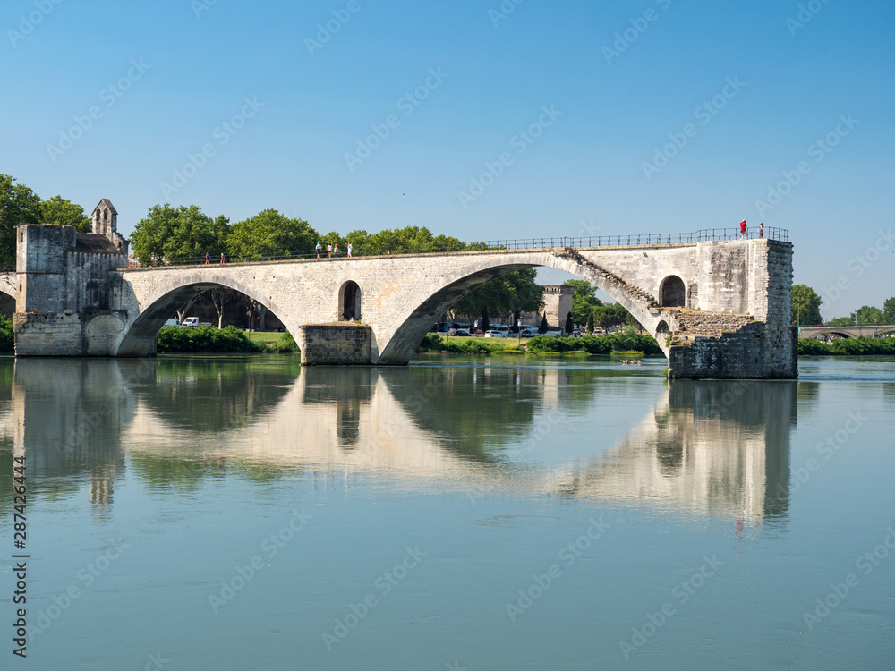 France, july 2019: Saint Benezet bridge and Palace of the Popes in Avignon in a beautiful summer day