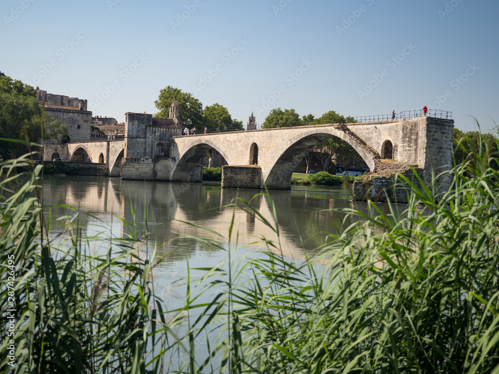 Fototapeta premium France, july 2019: Saint Benezet bridge and Palace of the Popes in Avignon in a beautiful summer day