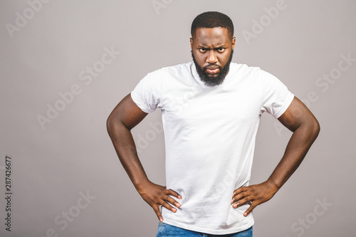 Portrait of angry or annoyed young African American man in casual looking at the camera with displeased expression. Negative human expressions, emotions, feelings. Body language