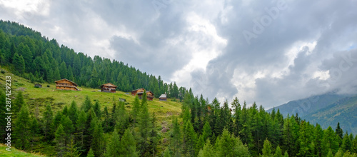 traditional alpine houses at kamelisenalm, innervillgraten, east tyrol, austria photo