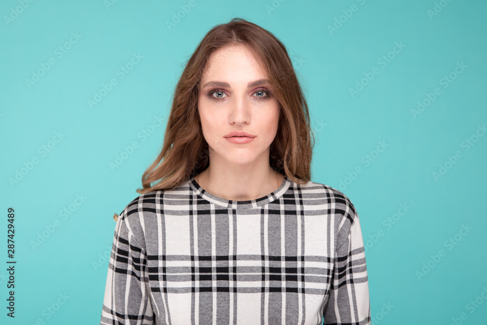 Fototapeta premium Female model isolated over the blue background