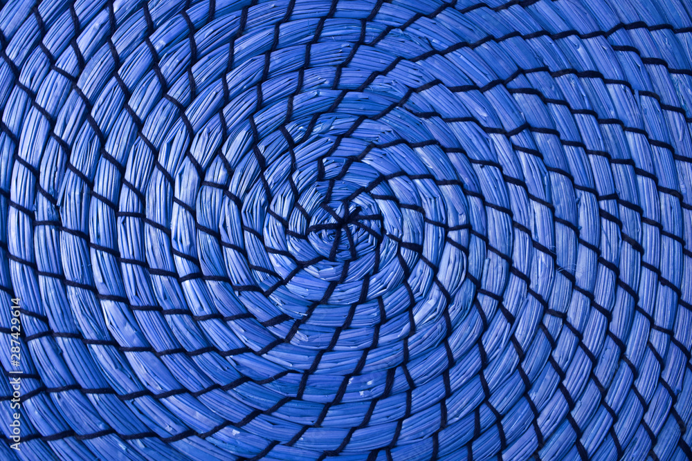 Obraz premium Abstract pattern of woven water hyacinth place mat in vivid royal blue color