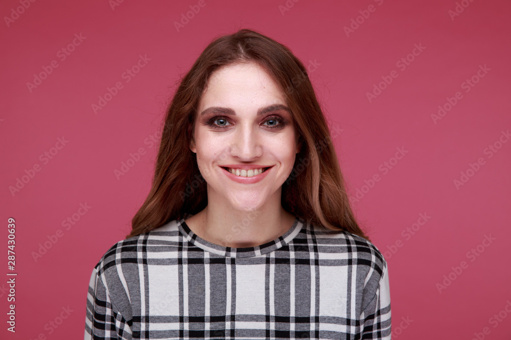 Portrait of pretty model isolated over the pink background Portrait of pretty model isolated over the pink background